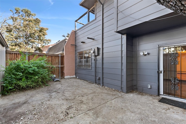 view of property exterior with a patio area