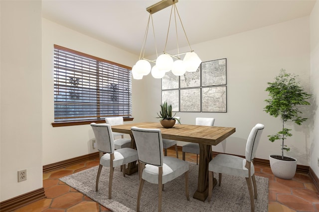 dining space featuring a notable chandelier