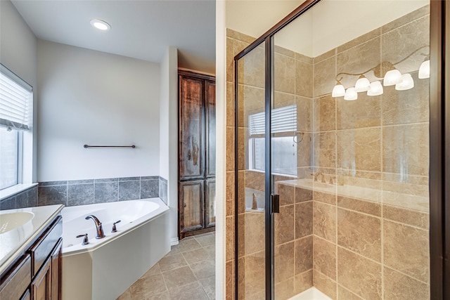 bathroom featuring vanity, separate shower and tub, and tile patterned floors