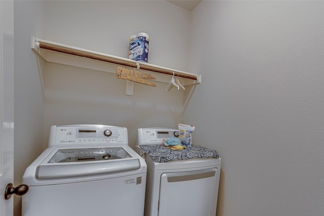 laundry room featuring separate washer and dryer