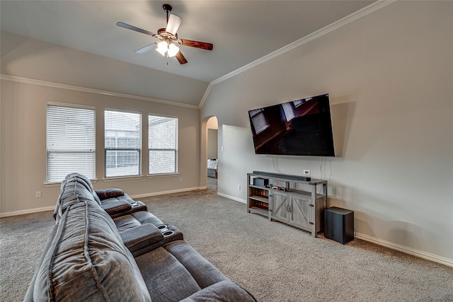 living room featuring ornamental molding, vaulted ceiling, carpet flooring, and ceiling fan