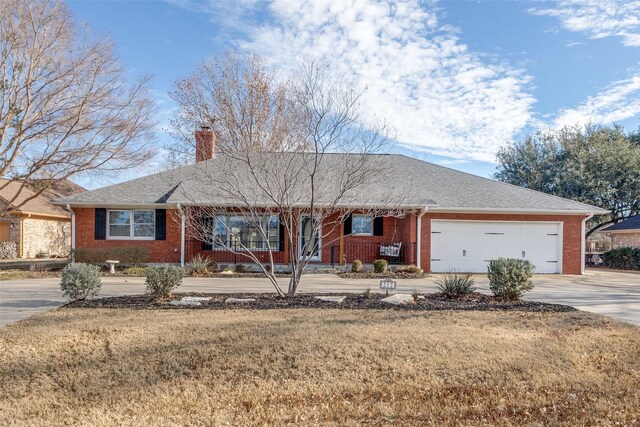 single story home featuring a front yard and a garage