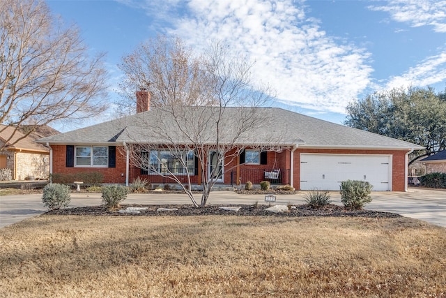 ranch-style home with a garage and a front lawn