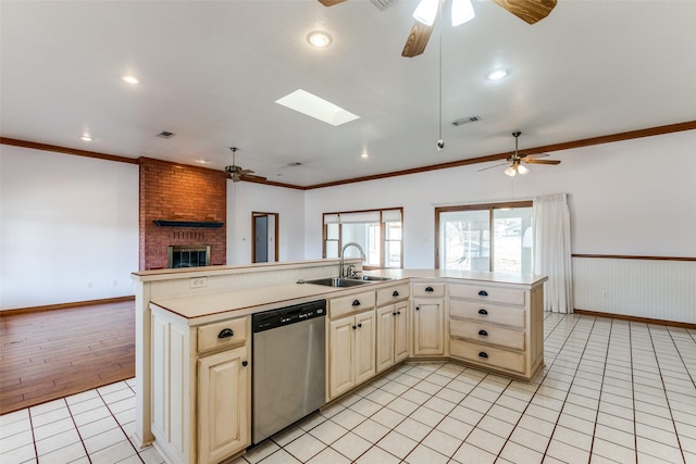 kitchen featuring stainless steel dishwasher, an island with sink, sink, and light tile patterned floors