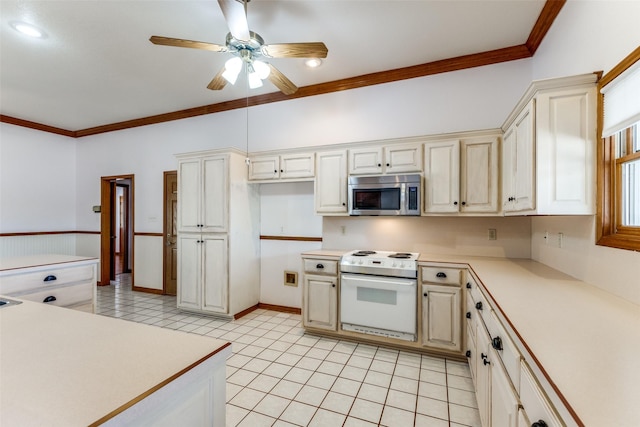 kitchen featuring ornamental molding, light tile patterned flooring, and white range with electric stovetop