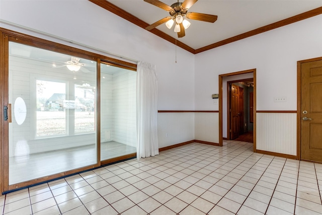 unfurnished room featuring light tile patterned floors, crown molding, and ceiling fan