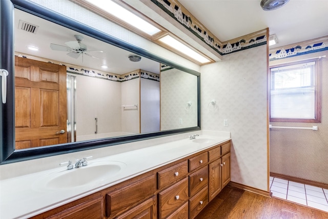 bathroom featuring vanity, hardwood / wood-style flooring, and ceiling fan