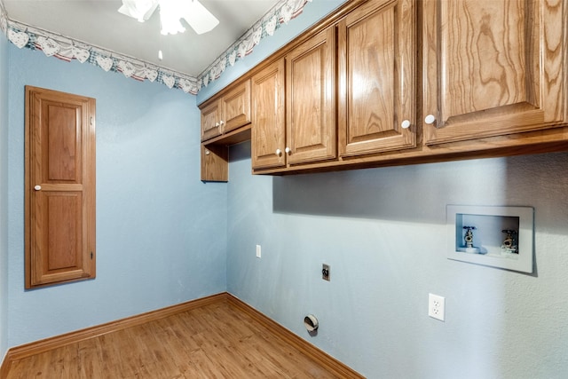 laundry area with cabinets, light hardwood / wood-style flooring, hookup for a washing machine, ceiling fan, and hookup for an electric dryer