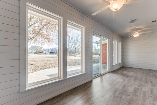 interior space featuring plenty of natural light and ceiling fan