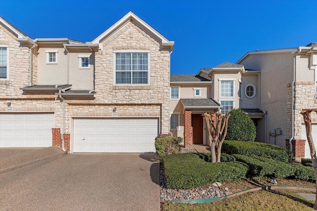 townhome / multi-family property featuring a garage