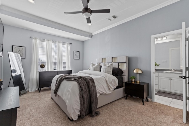 bedroom with connected bathroom, ceiling fan, sink, light carpet, and ornamental molding