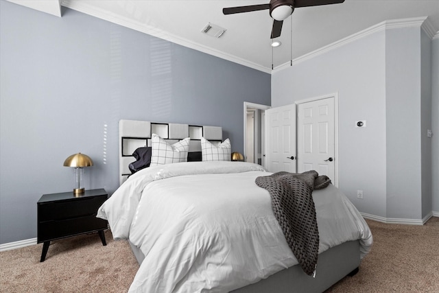 carpeted bedroom featuring ceiling fan and crown molding