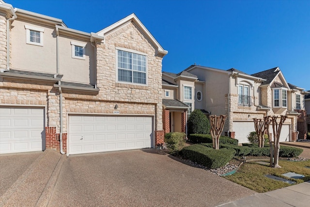 townhome / multi-family property featuring a garage