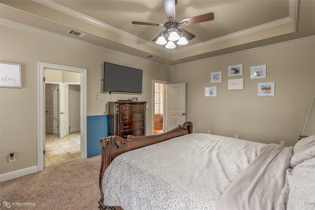 carpeted bedroom featuring a raised ceiling, ceiling fan, and ornamental molding