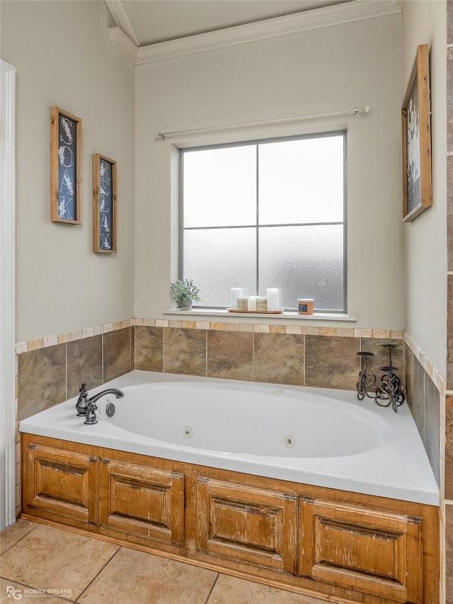 bathroom with a washtub, tile patterned flooring, and ornamental molding