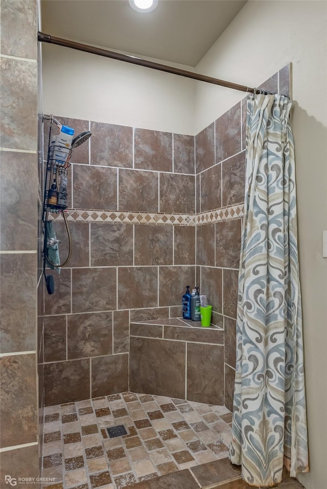 bathroom with a shower with shower curtain