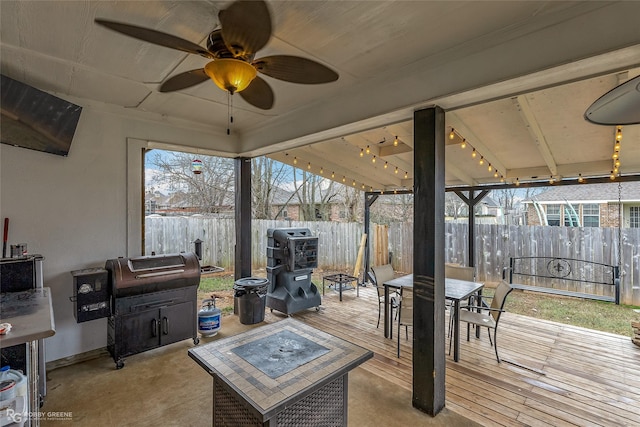 interior space featuring area for grilling and ceiling fan