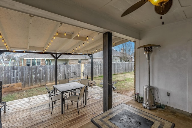 wooden deck featuring ceiling fan