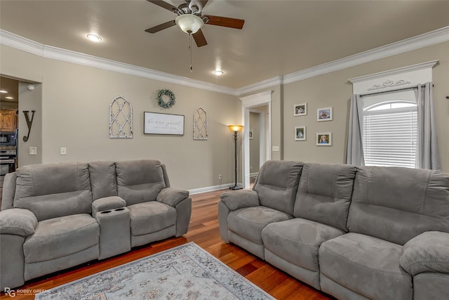 living room featuring ceiling fan, wood-type flooring, and ornamental molding