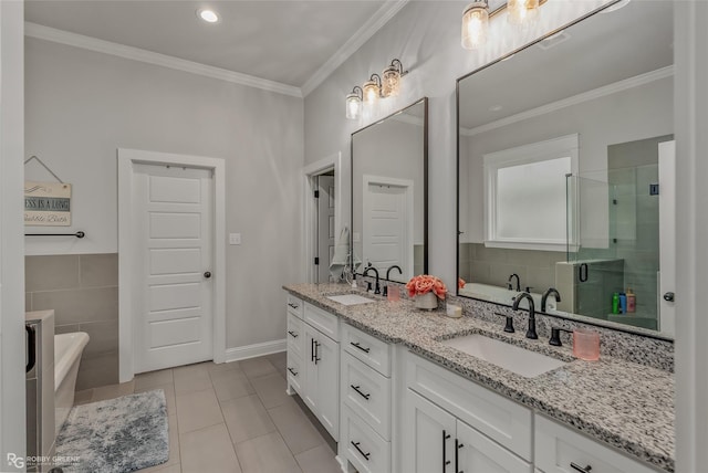 bathroom featuring tile patterned flooring, ornamental molding, vanity, and independent shower and bath