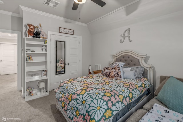 carpeted bedroom with ceiling fan, lofted ceiling, and ornamental molding