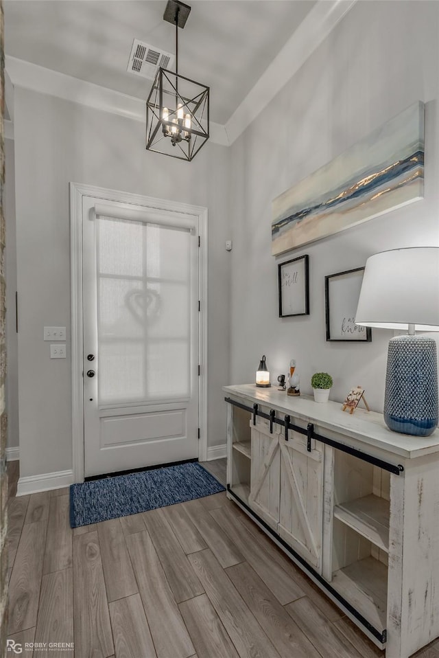 foyer entrance featuring a chandelier