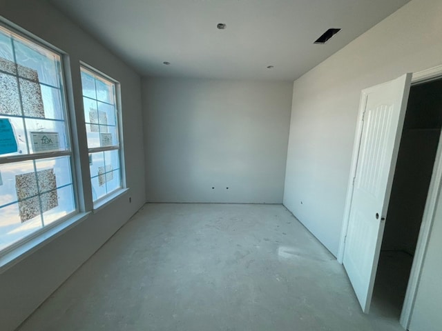 spare room featuring plenty of natural light