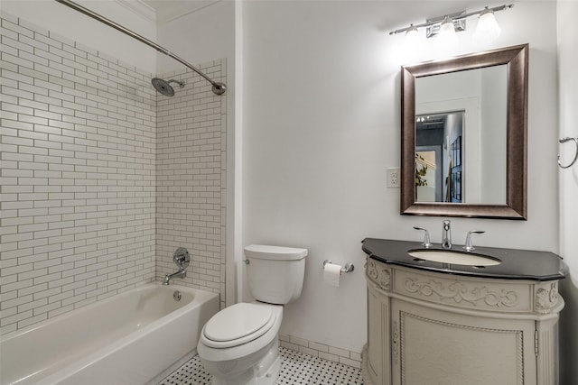 full bathroom featuring toilet, vanity, and tiled shower / bath