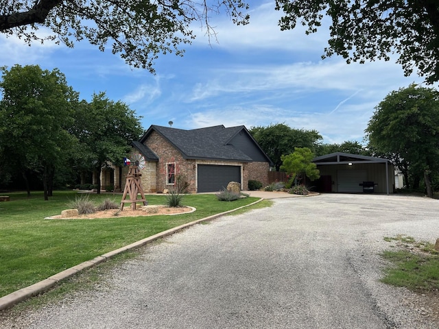 view of front of home with a front yard and a garage