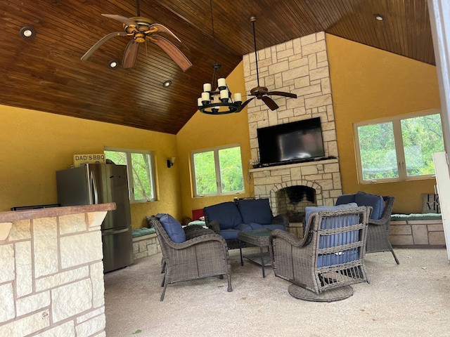 living room featuring wood ceiling, ceiling fan, an outdoor stone fireplace, high vaulted ceiling, and carpet floors