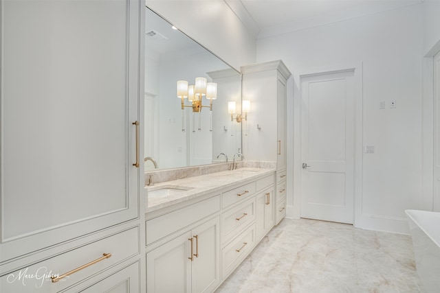 bathroom featuring vanity, a bathtub, and ornamental molding