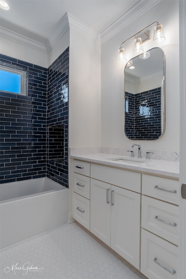 bathroom with crown molding, tile patterned floors, vanity, and tiled shower / bath combo