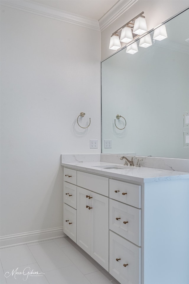 bathroom featuring crown molding and vanity