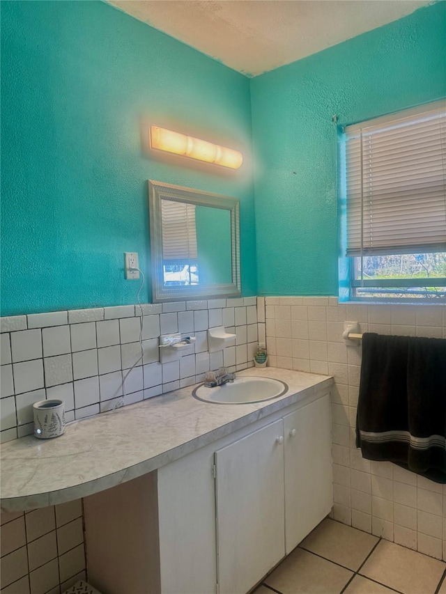 bathroom featuring tile walls, vanity, and tile patterned floors