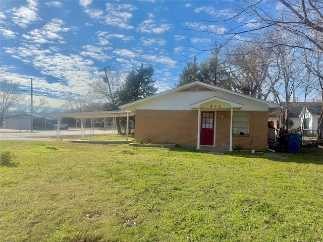 exterior space featuring a front lawn and a carport