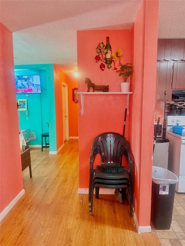 interior space with hardwood / wood-style flooring and a textured ceiling