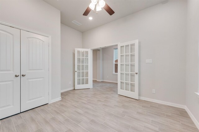 unfurnished living room with hardwood / wood-style flooring, lofted ceiling, and ceiling fan