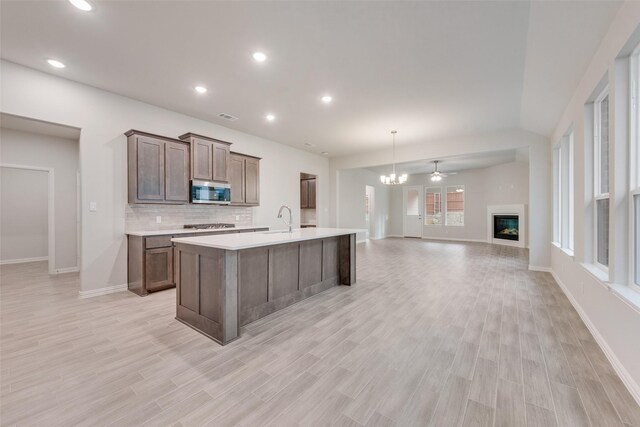 unfurnished room with light carpet and a raised ceiling