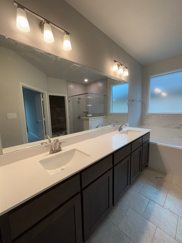 bathroom featuring vanity, lofted ceiling, and shower with separate bathtub