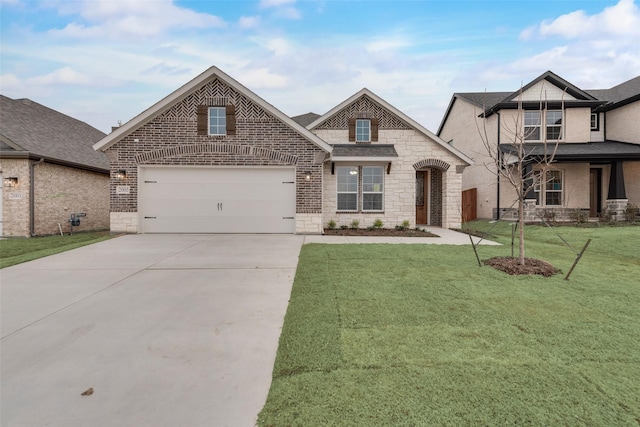 view of front facade featuring driveway, stone siding, an attached garage, a front yard, and brick siding