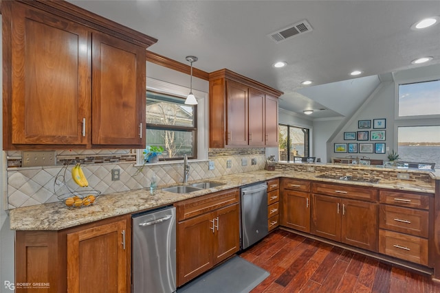 kitchen featuring dishwasher, sink, tasteful backsplash, dark hardwood / wood-style flooring, and decorative light fixtures