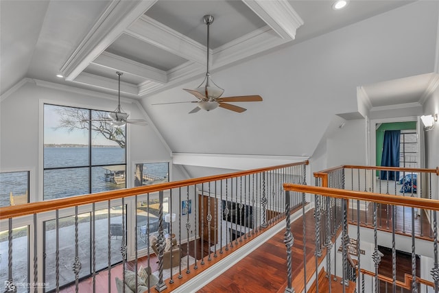 hall with hardwood / wood-style floors, a water view, a wealth of natural light, and crown molding