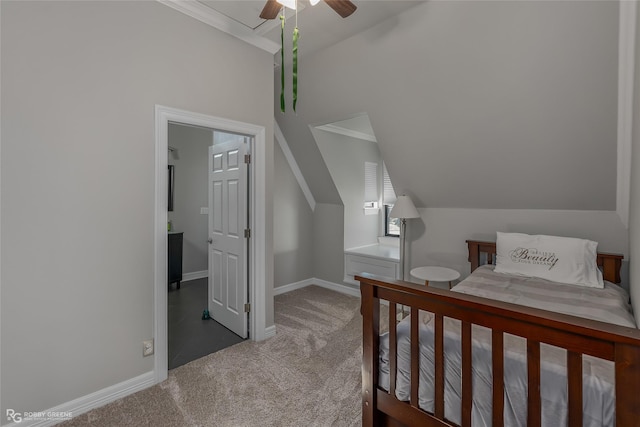 bedroom featuring dark colored carpet, vaulted ceiling, ceiling fan, and crown molding