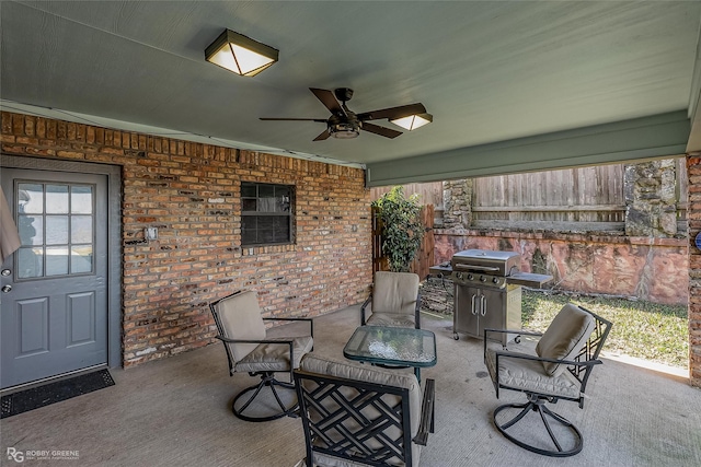 view of patio featuring a grill and ceiling fan