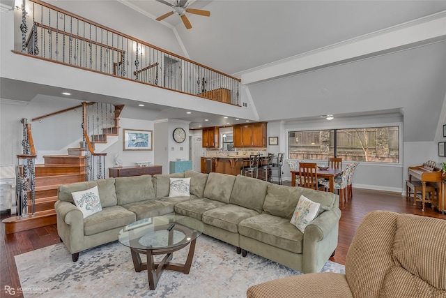 living room featuring crown molding, ceiling fan, wood-type flooring, and high vaulted ceiling