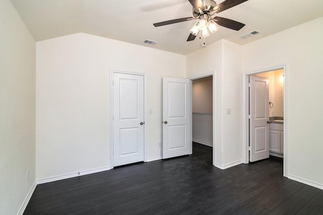 unfurnished bedroom with vaulted ceiling, dark hardwood / wood-style floors, and ceiling fan