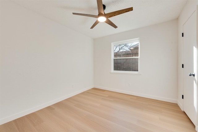 spare room with ceiling fan and light hardwood / wood-style flooring