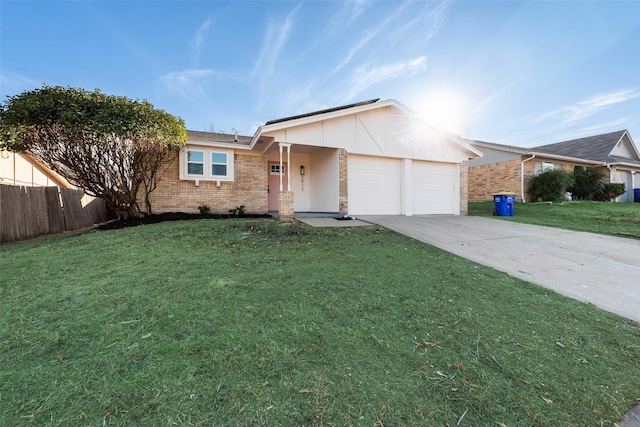 ranch-style home with a garage and a front lawn