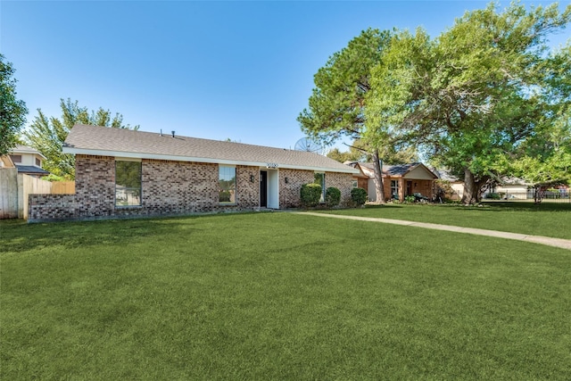 ranch-style home with a front yard