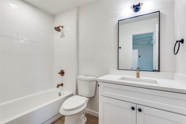 full bathroom featuring vanity, toilet, and tiled shower / bath